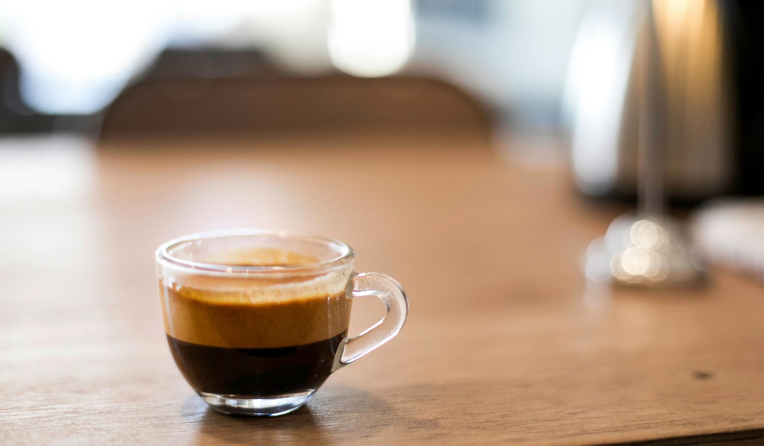 cup of espresso on a wooden table