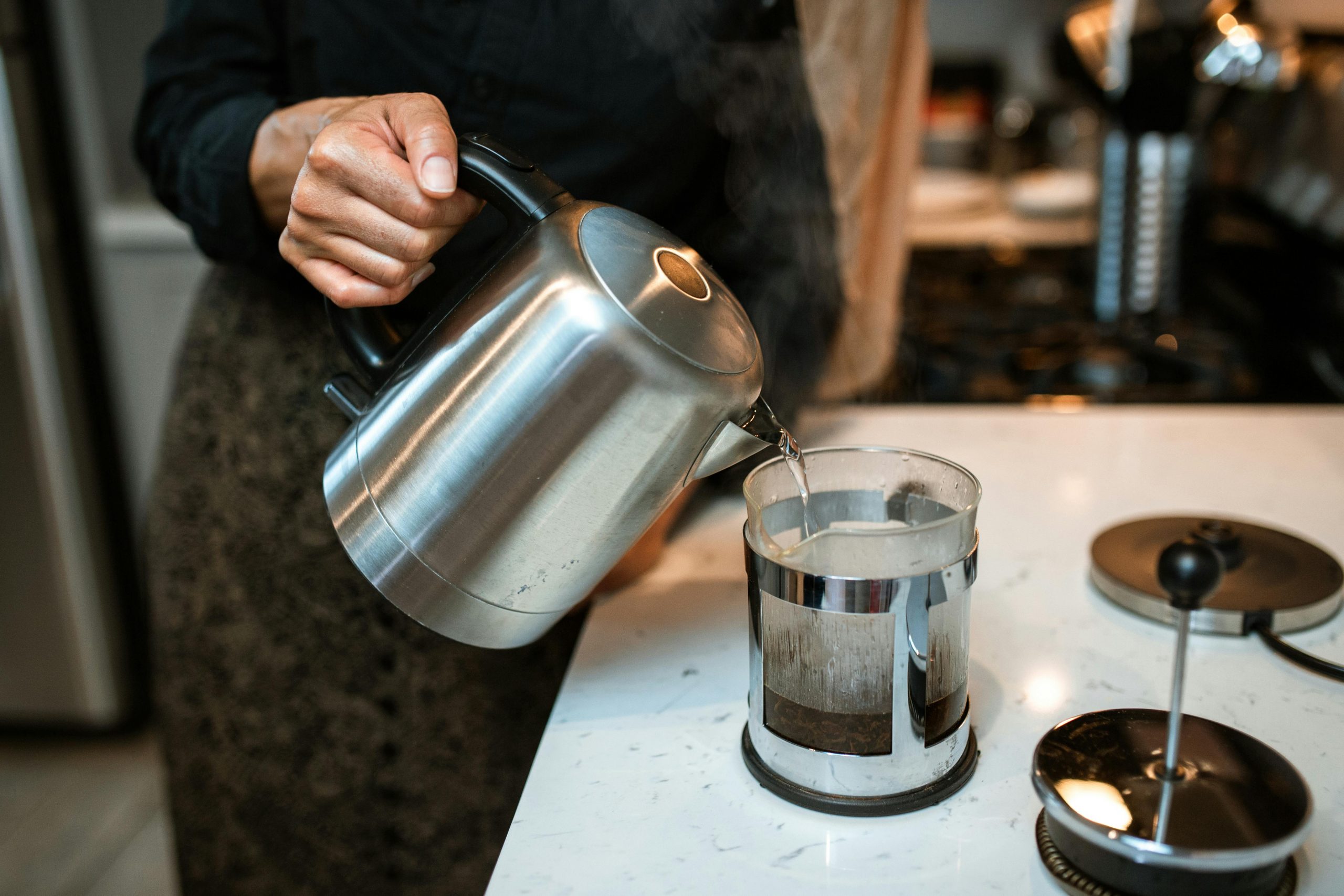 hot water being poured into a French press